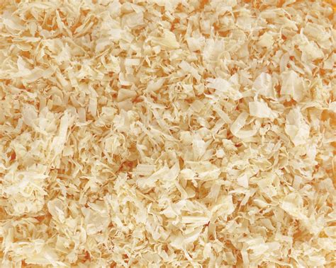 Dindes élevées sur une litière accumulée de copeaux de bois et de déjections